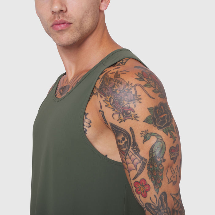 Laser-Vent Tank Top in olive worn by model, side view showcasing sleeve and tattoos