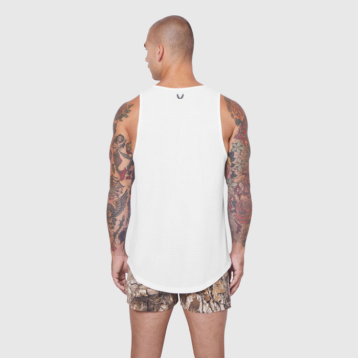 White Laser-Vent Tank Top worn by model, back view, with camouflage shorts