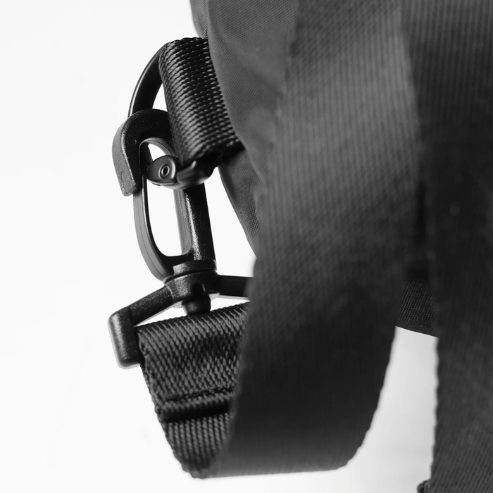 Waterproof Drawstring Rec Bag in Black, worn on shoulder detail