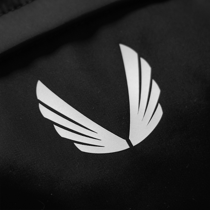 Flatlay of Large Waterproof Crossbody Bag in black, logo detail closeup