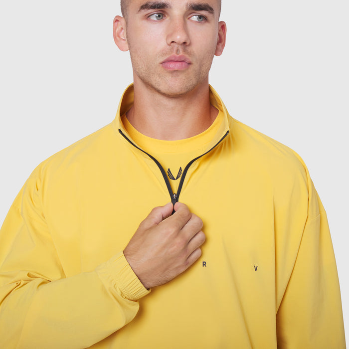 Aerotex Quarter-Zip Jacket in amber yellow worn by male model, front view