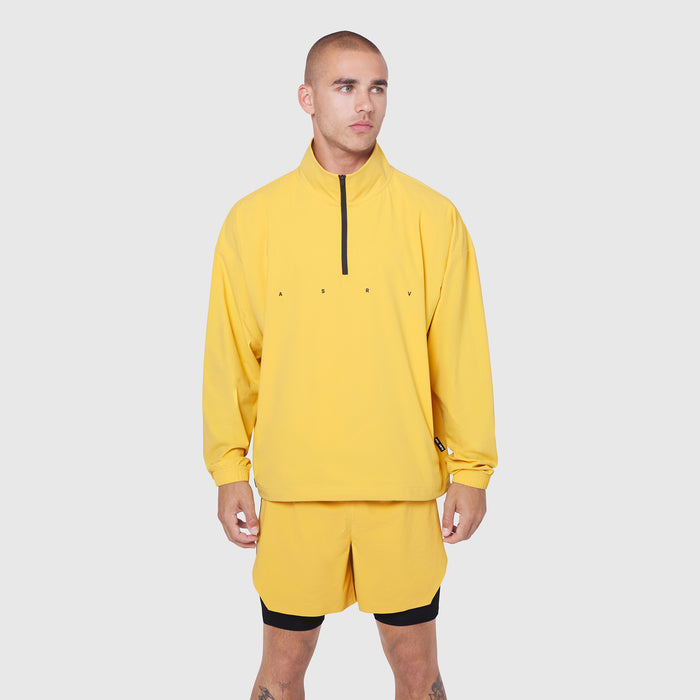 Aerotex Quarter-Zip Jacket in amber yellow worn by model, front view