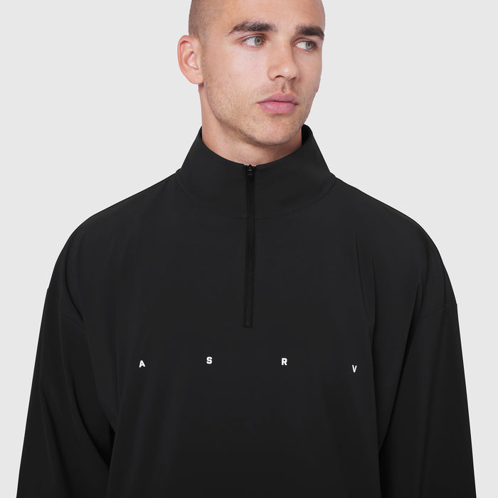 Aerotex Quarter-Zip Jacket in black worn by male model, front view