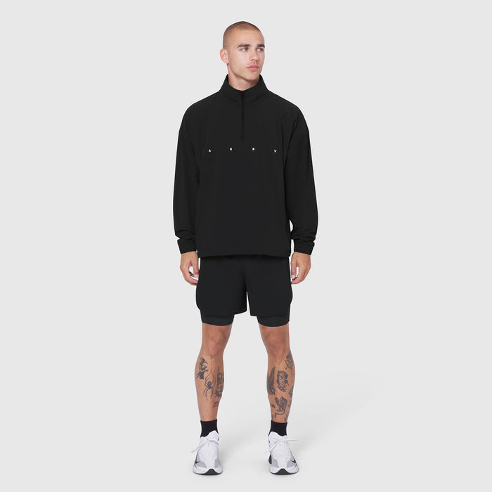 Black Aerotex Quarter-Zip Jacket worn with matching shorts, front view on model