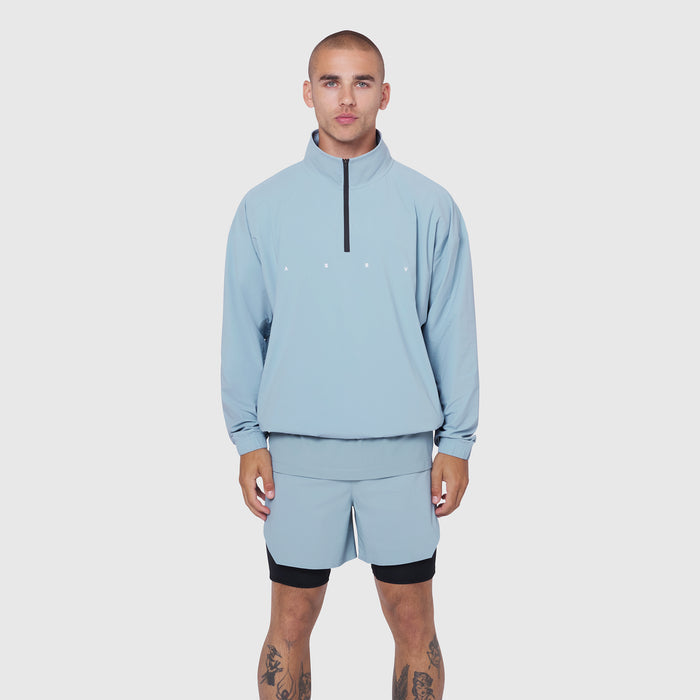 Aerotex Quarter-Zip Jacket in light sky, worn by model with matching shorts, front view