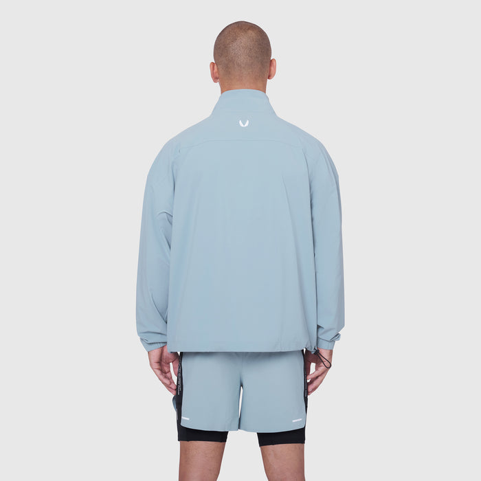 Aerotex Quarter-Zip Jacket in light sky, back view on model