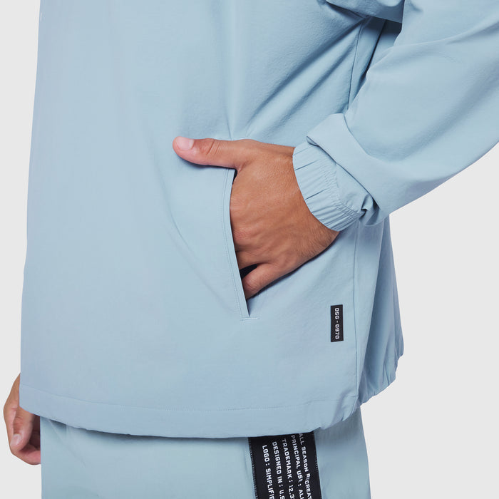 Aerotex Quarter-Zip Jacket in light sky blue, worn by model with hand in pocket