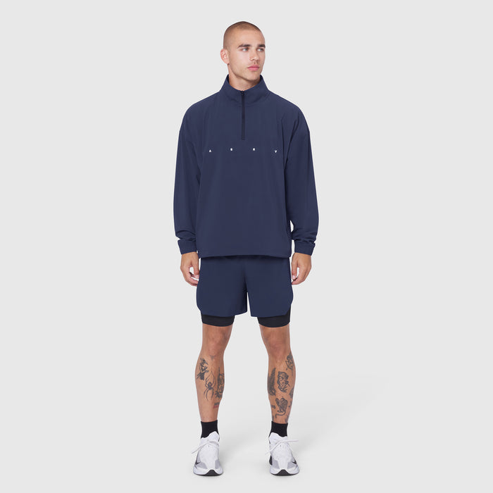 Navy Aerotex Quarter-Zip Jacket worn with matching shorts and white sneakers, front view