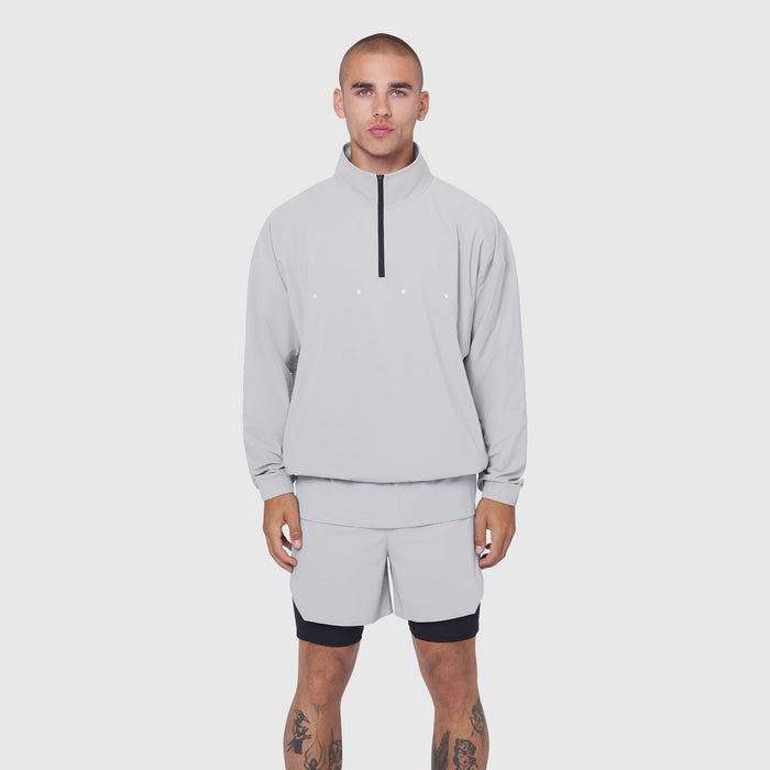 Aerotex Quarter-Zip Jacket in slate grey worn with matching shorts, front view