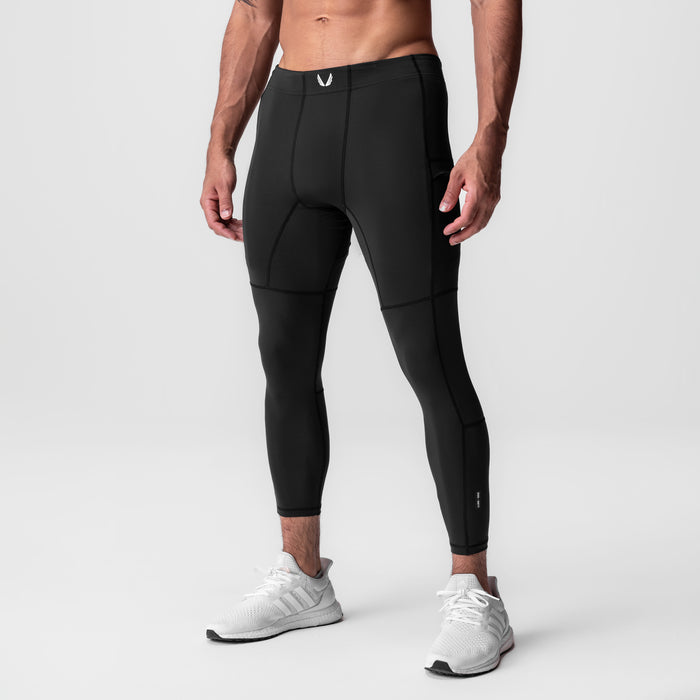 WarpFlexx-Lite® 3/4-Length Legging in black, modeled on male athlete wearing white sneakers