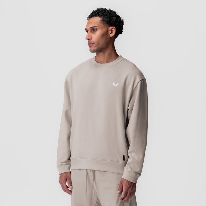 Herringbone Terry Crewneck in Chai worn by model, front profile view