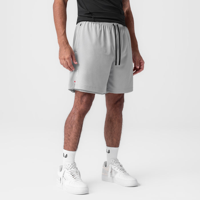 Reversible 2-in-1 short in slate grey worn by model, front view