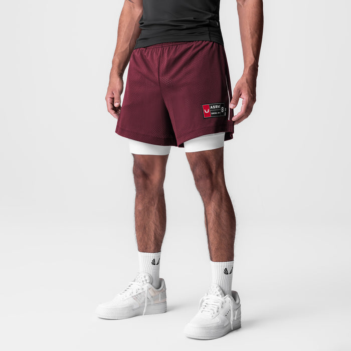 Ion-Mesh 5" Liner Short in crimson with white undershorts, modeled with white sneakers and socks