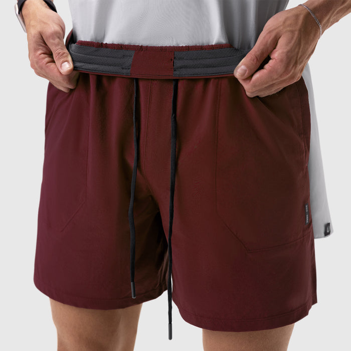 Aerotex™ 6" Training Short in crimson, worn by model adjusting waistband