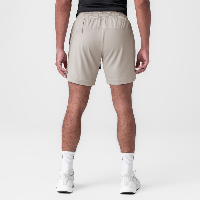 AeroSilver 7" Linerless Short in Chai, back view on model