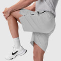 Aerotex™ 8" Training Short in Slate Grey, worn by model lifting leg, front view