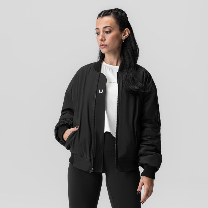 Women's Sherpa-Lined Insulated Bomber Jacket in black, worn with white tee, front view
