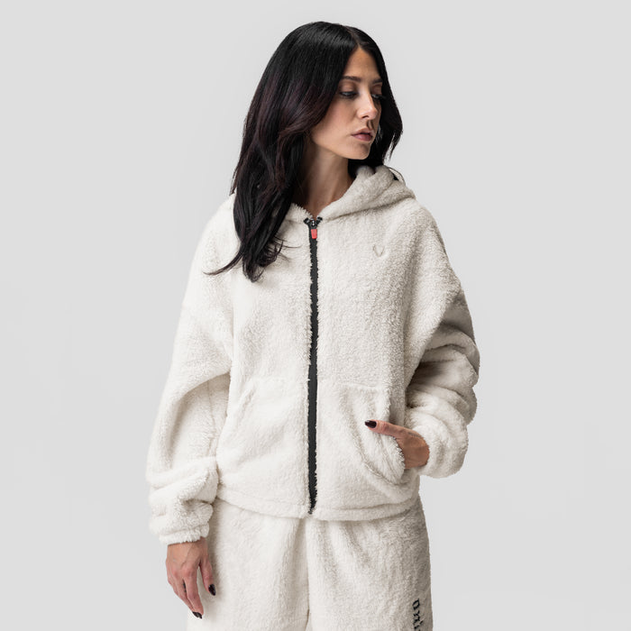 Women's Sherpa Recovery Full Zip Hoodie in ivory cream, worn by model in side profile