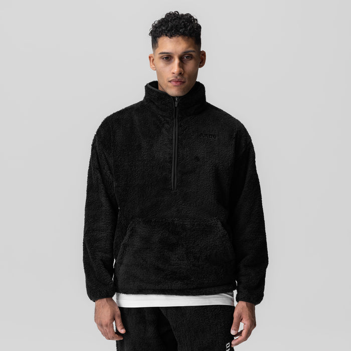 Black Sherpa Recovery 1/2 Zip worn by model, front view with white undershirt