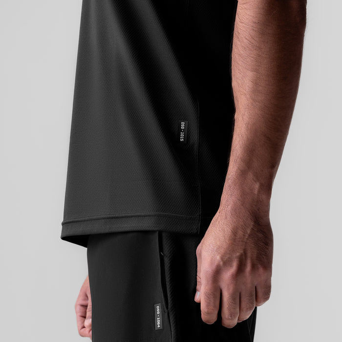 AeroSilver Essential Tee in black worn by model, side view detail