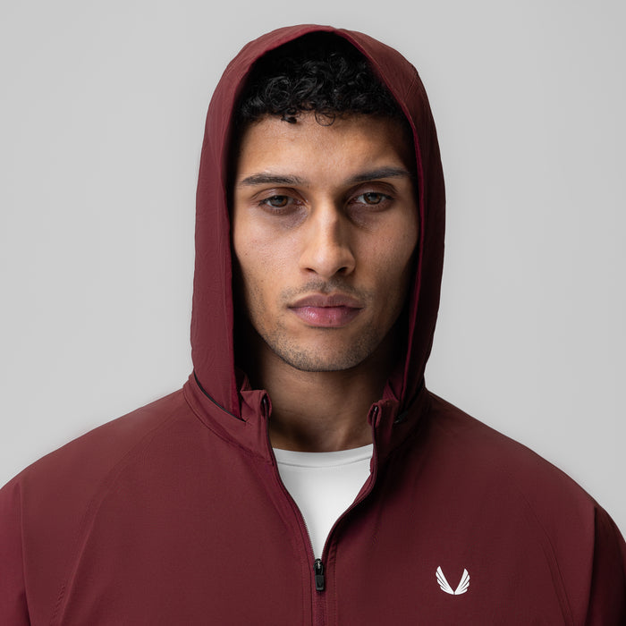 Aerotex Weather-Ready Bonded Windbreaker in crimson, worn with hood up