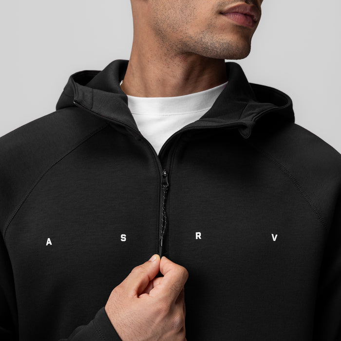 Black Dri-Core™ Zip Hoodie worn by model, front view with hand on zipper