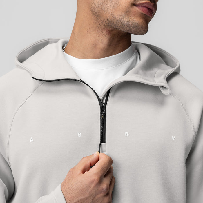 Dri-Core™ Zip Hoodie in light grey, modeled by man holding zipper pull
