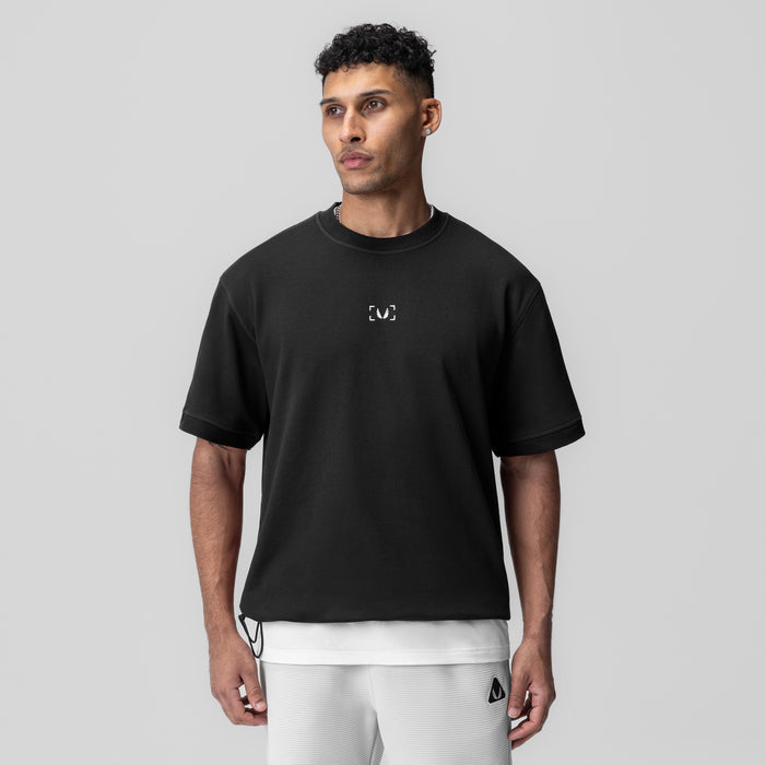 Herringbone Terry Oversized Cinch Tee in black, worn by model, front view