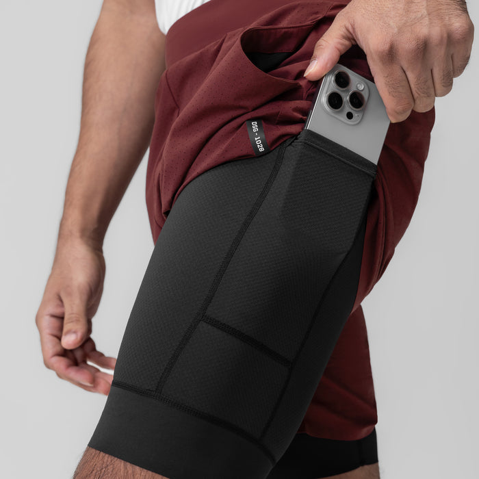 Aerotex™ Bonded 7" Liner Short in Crimson, model holding phone in side pocket