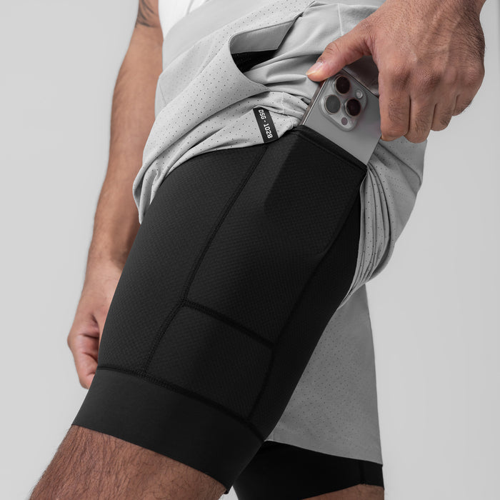 Aerotex Bonded 7" Liner Short in Slate Grey, model holding phone in side pocket
