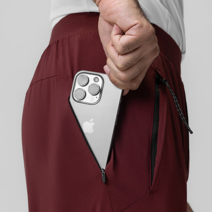 Aerotex Weather-Ready Bonded Pant in crimson, worn with model holding iPhone in jacket pocket
