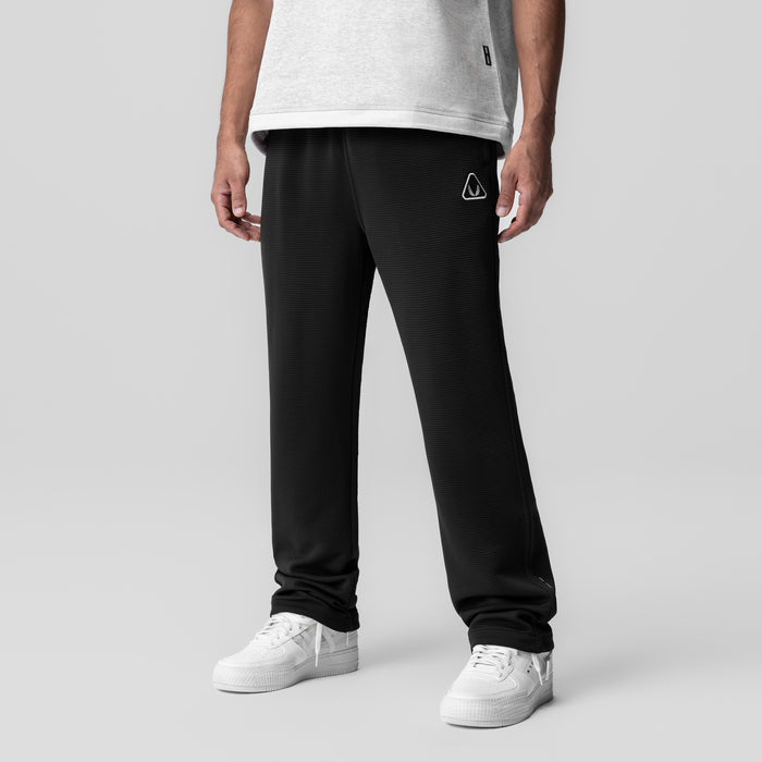 Deltapeak® Straight Leg Sweats in black worn by model with white t-shirt and white sneakers, front view