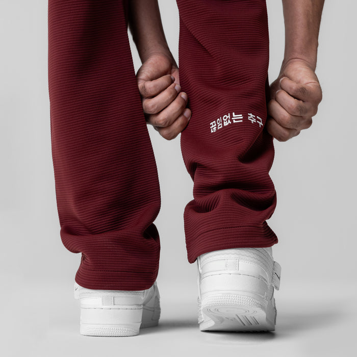 Deltapeak® Straight Leg Sweats in crimson, worn by model holding hands, rear view