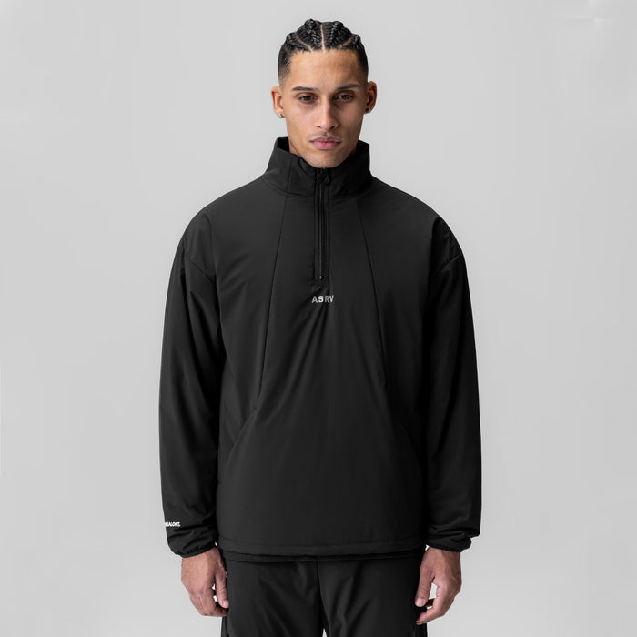 Aerotex PrimaLoft Quarter Zip in black, worn by model, front view