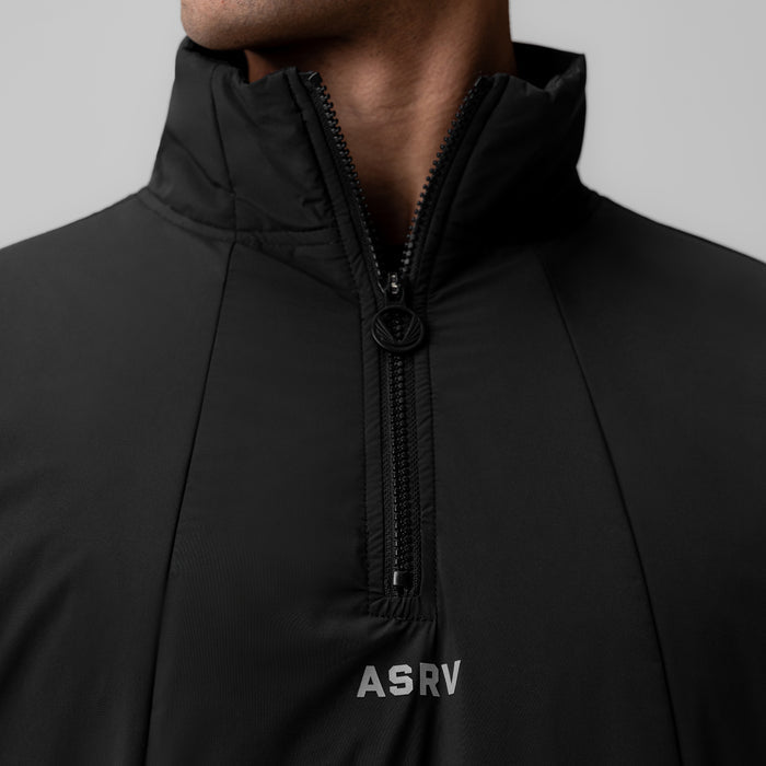 Aerotex PrimaLoft quarter zip jacket in black, worn by model, front detail view