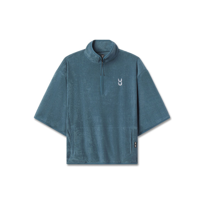 flatlay Towel Terry Quarter Zip Oversized Tee in storm blue, front view