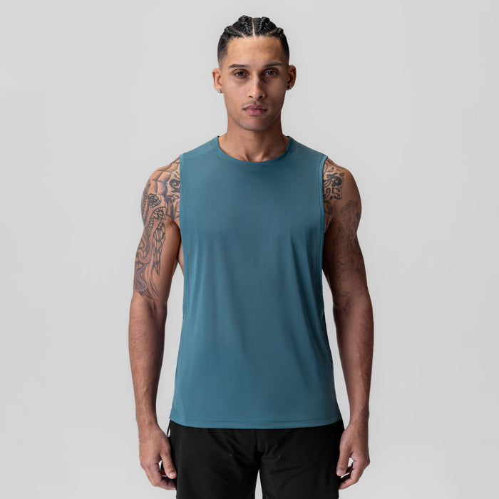 Ice-Skin™ Muscle Tank in storm blue, worn by model facing forward