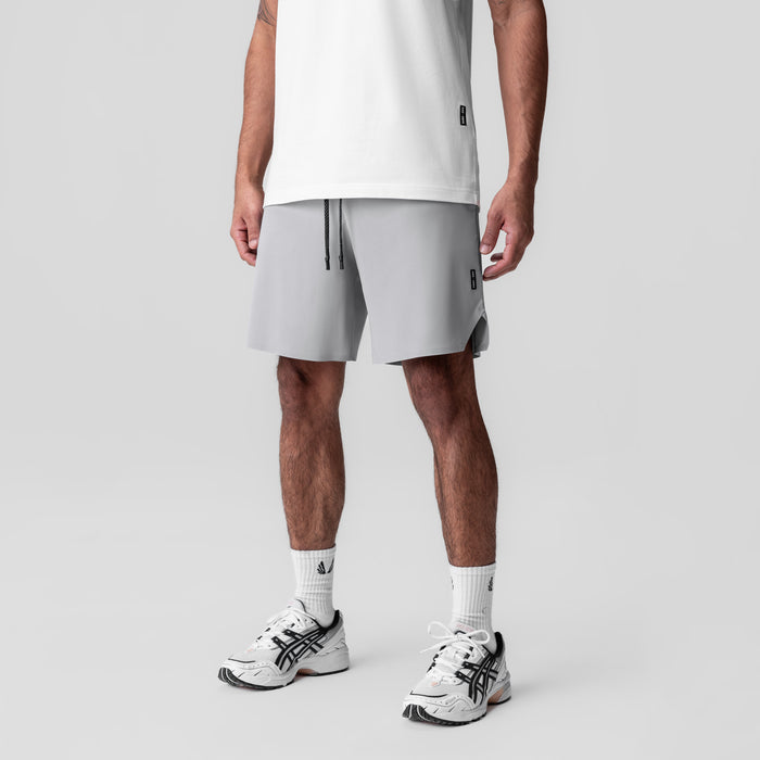 Revolutional Field Short in slate grey, worn by model with white tee and white sneakers