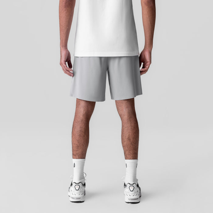 Revolutional Field Short in slate grey, back view on model wearing white tee and white sneakers