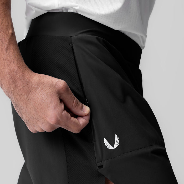 Tetra-Lite 6" Bonded Training Short in black, worn with hand in pocket detail