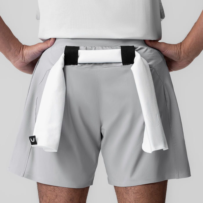 Tetra-Lite Bonded Training Short in Slate Grey, worn with towel draped over shoulder