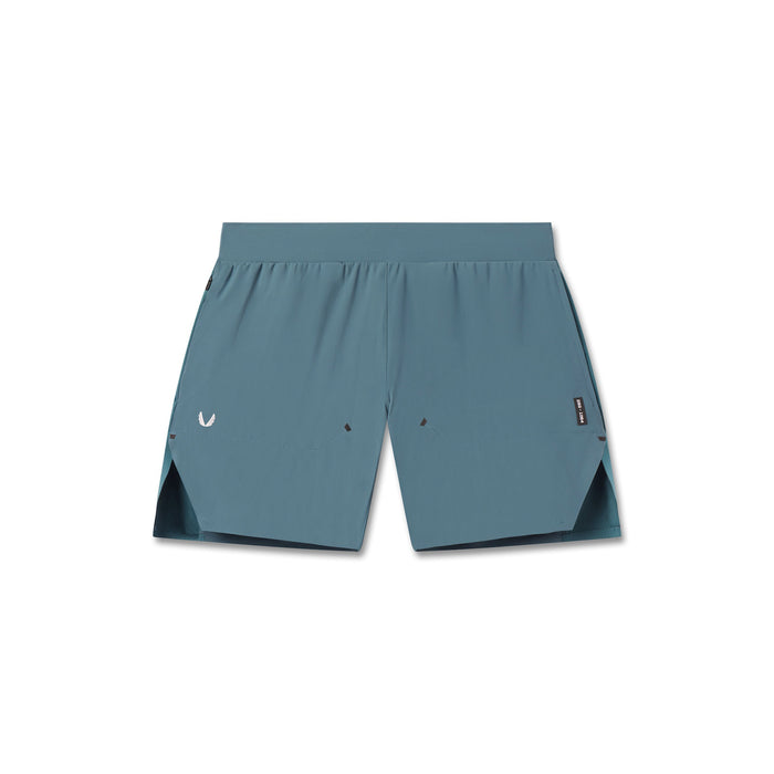 flatlay Tetra-Lite® 6" Bonded Training Short in storm blue with black side panels, front view
