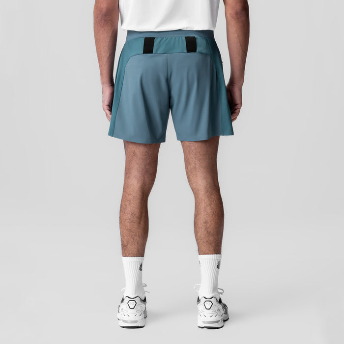 Tetra-Lite Bonded Training Short in storm blue, back view on model