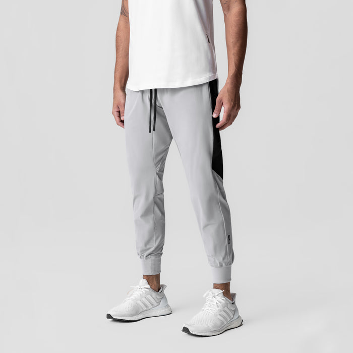 Tetra-Lite® Cuffed Training Jogger in slate grey with black side panels, worn by model, front view