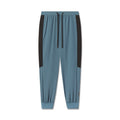 flatlay Tetra-Lite® Cuffed Training Jogger in storm blue with black side panels, front view