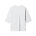 Flatlay of white Supima® 3/4-sleeve oversized tee on white background, front view