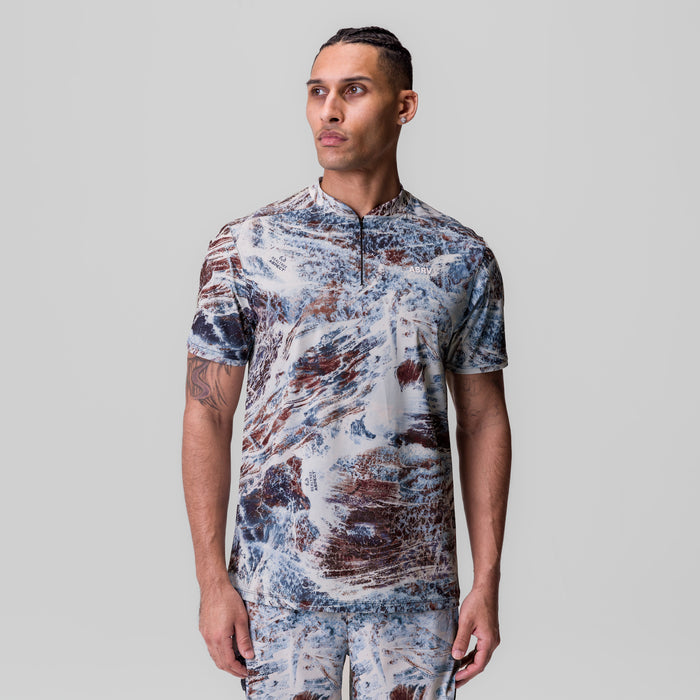 Tetra-Lite Ice Zip Tee in blue and brown marble camo, frontal view on model