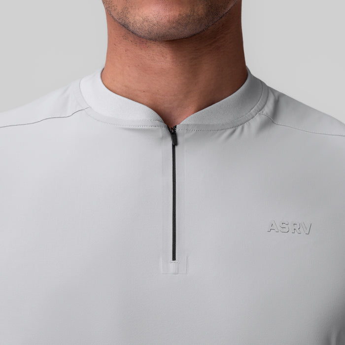 Tetra-Lite Ice Zip Tee in slate grey, worn by model, chest detail view