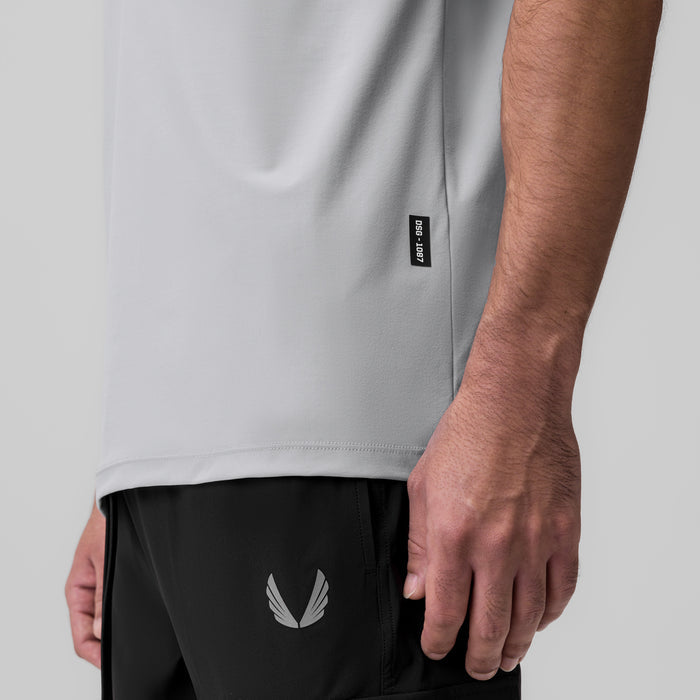 Tetra-Lite Ice Zip Tee in slate grey worn by model, side detail view