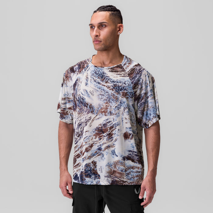 Ice-Skin Oversized Tee in white/blue/brown Realtree print, worn by model, front view